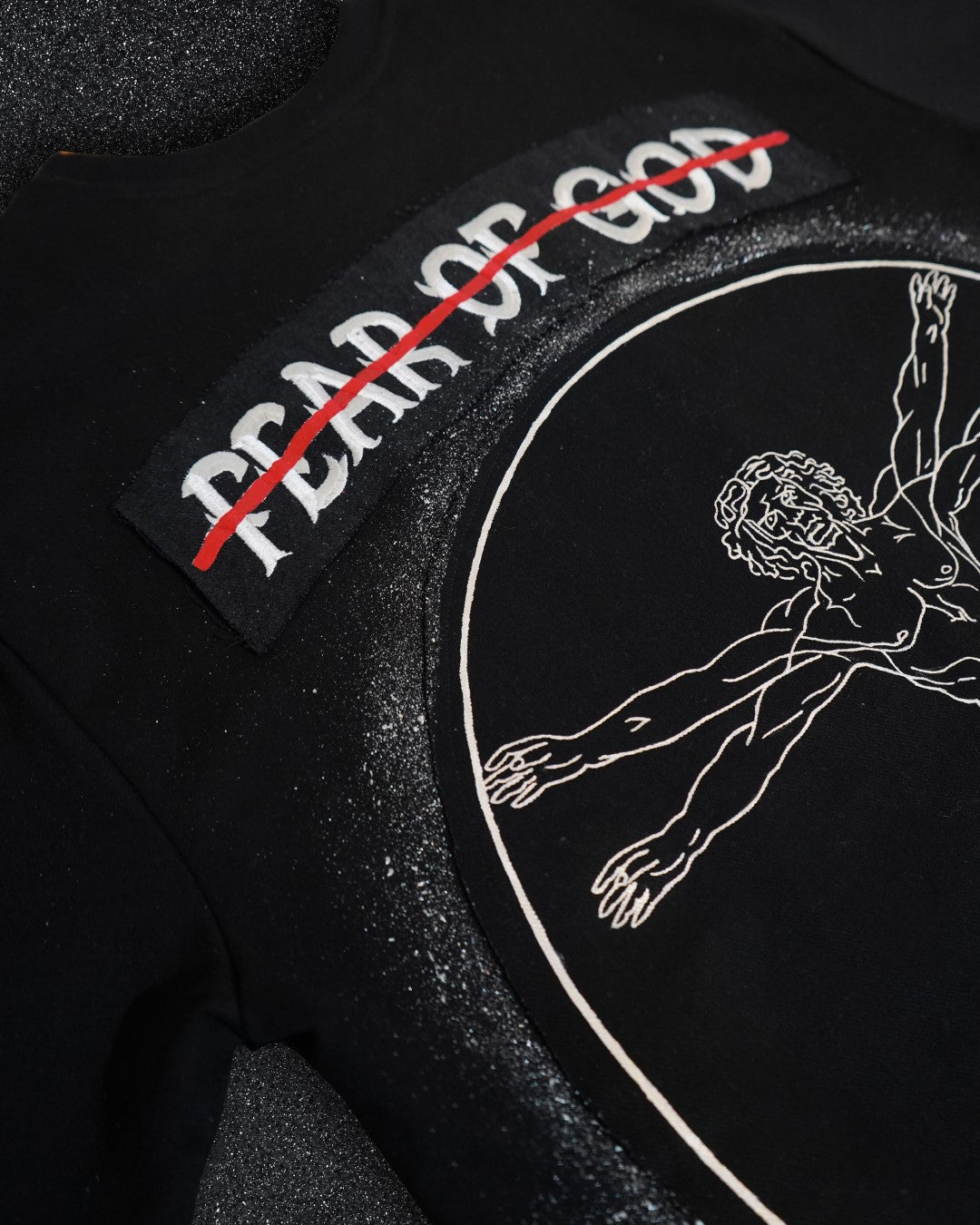 FEAR OF GOD vs VITRUVIAN MAN BLACK VALKYRE TSHIRT