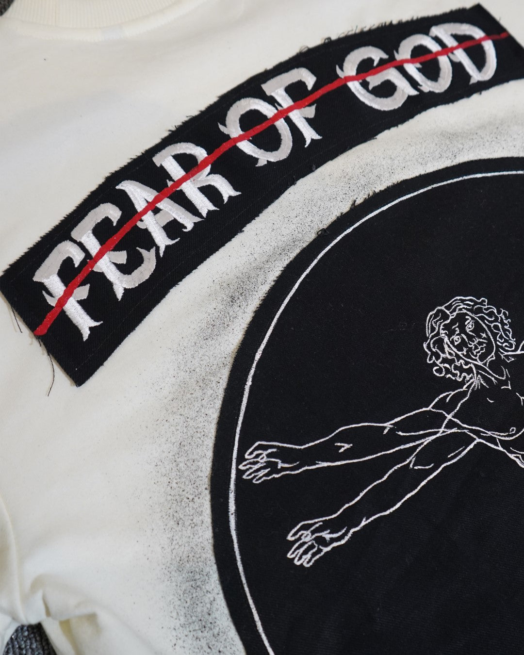 FEAR OF GOD vs VITRUVIAN MAN BLACK VALKYRE TSHIRT